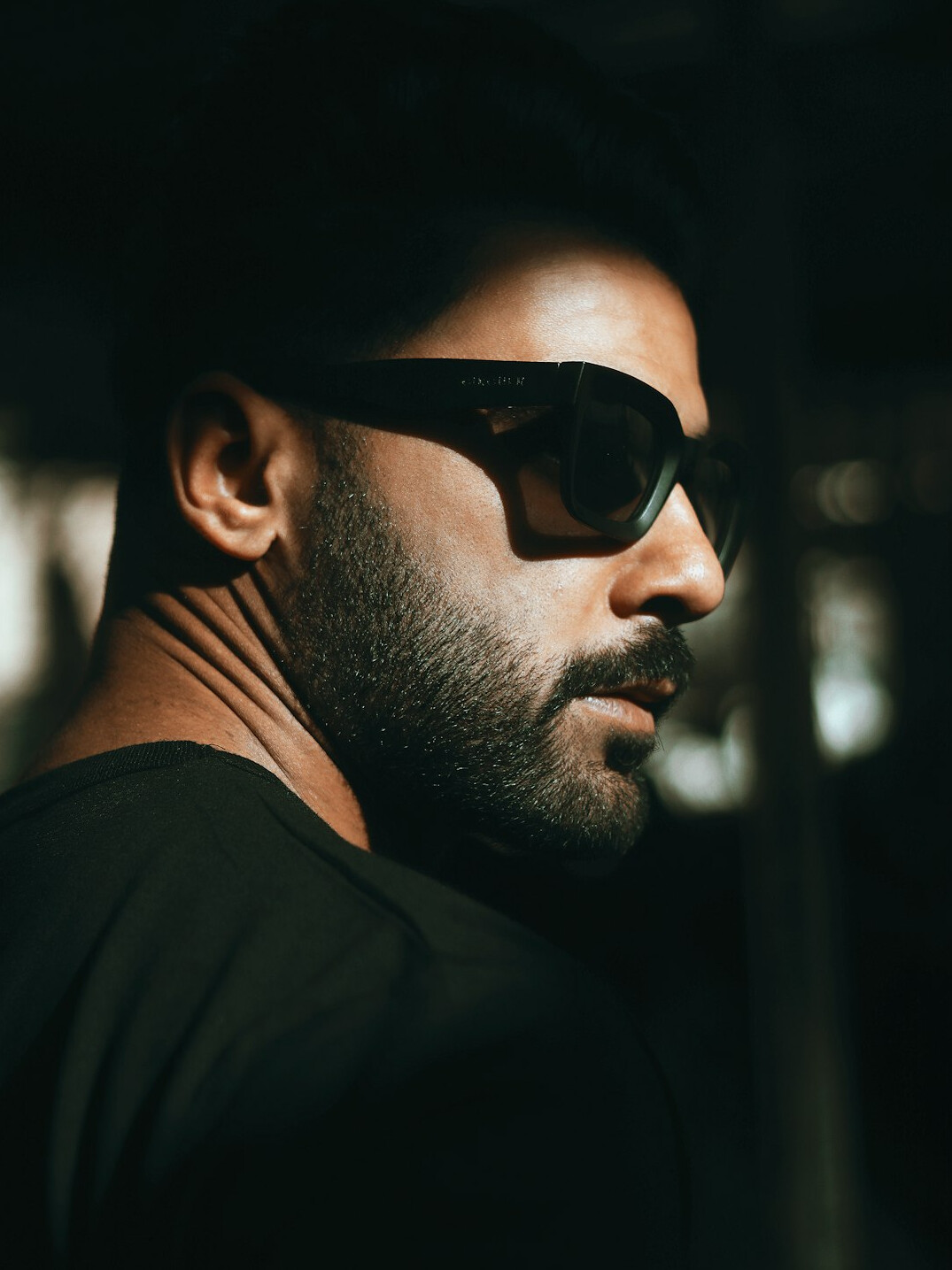 Portrait of a Croatian man with short beard and glasses in a business casual outfit