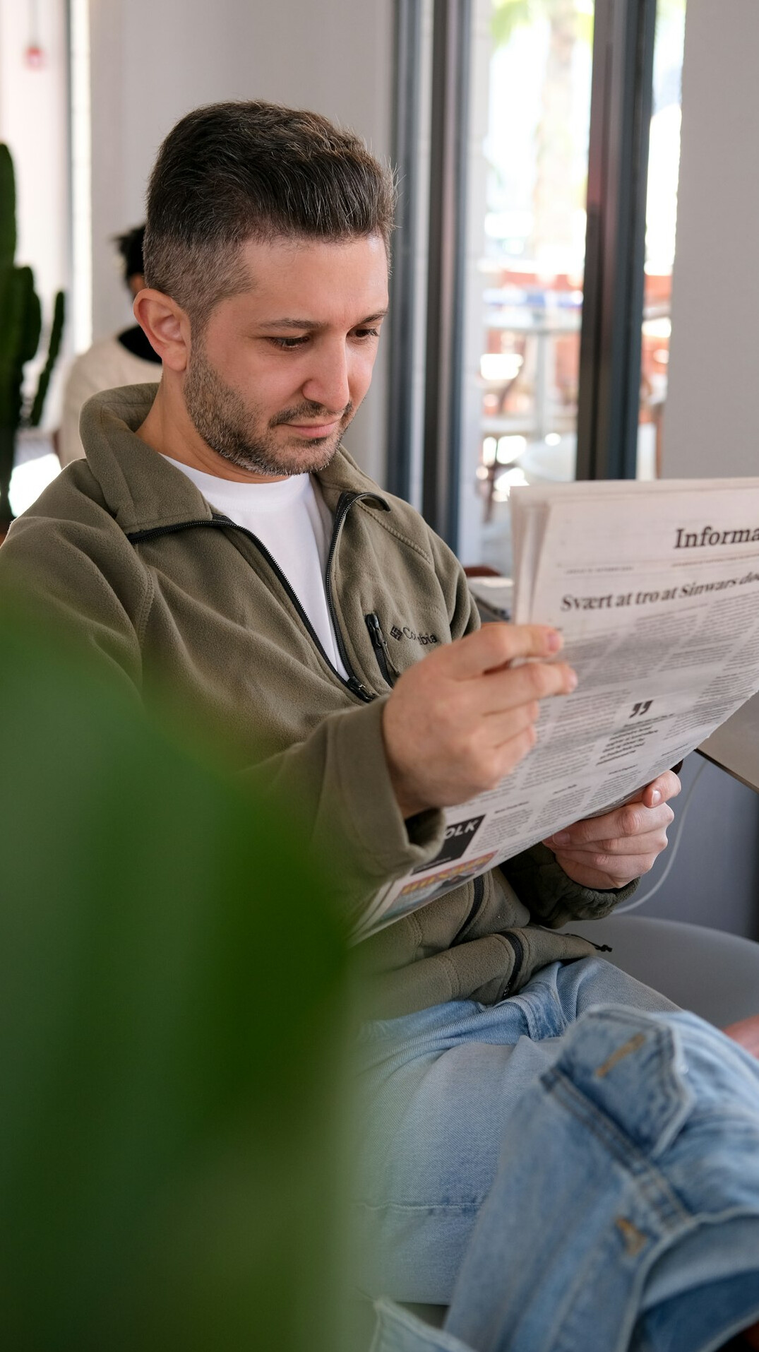 surprised person reading insurance papers